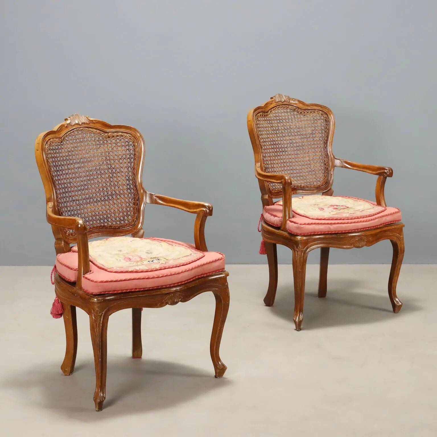 Antique baroque-style armchairs in walnut and fabric, 19th century.