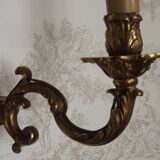 Pair of French baroque brass wall sconces with two branches, decorated with acanthus and wickerwork.