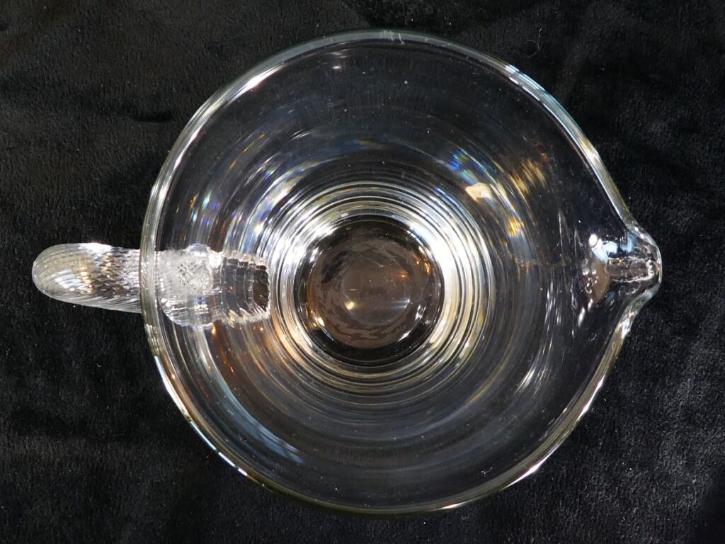 Pitcher Carafe has orangeade em blown glass