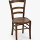 Antique wooden chair with a pyrographed shell motif seat.
