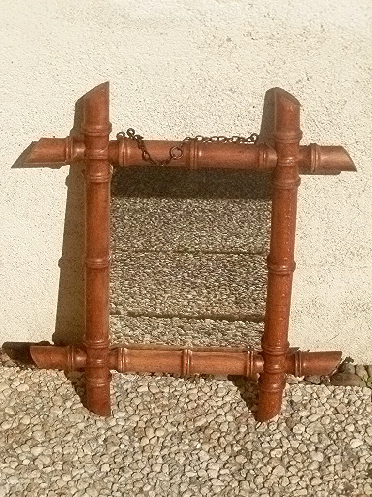 Old wooden mirror, carved bamboo way