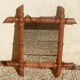 Old wooden mirror, carved bamboo way