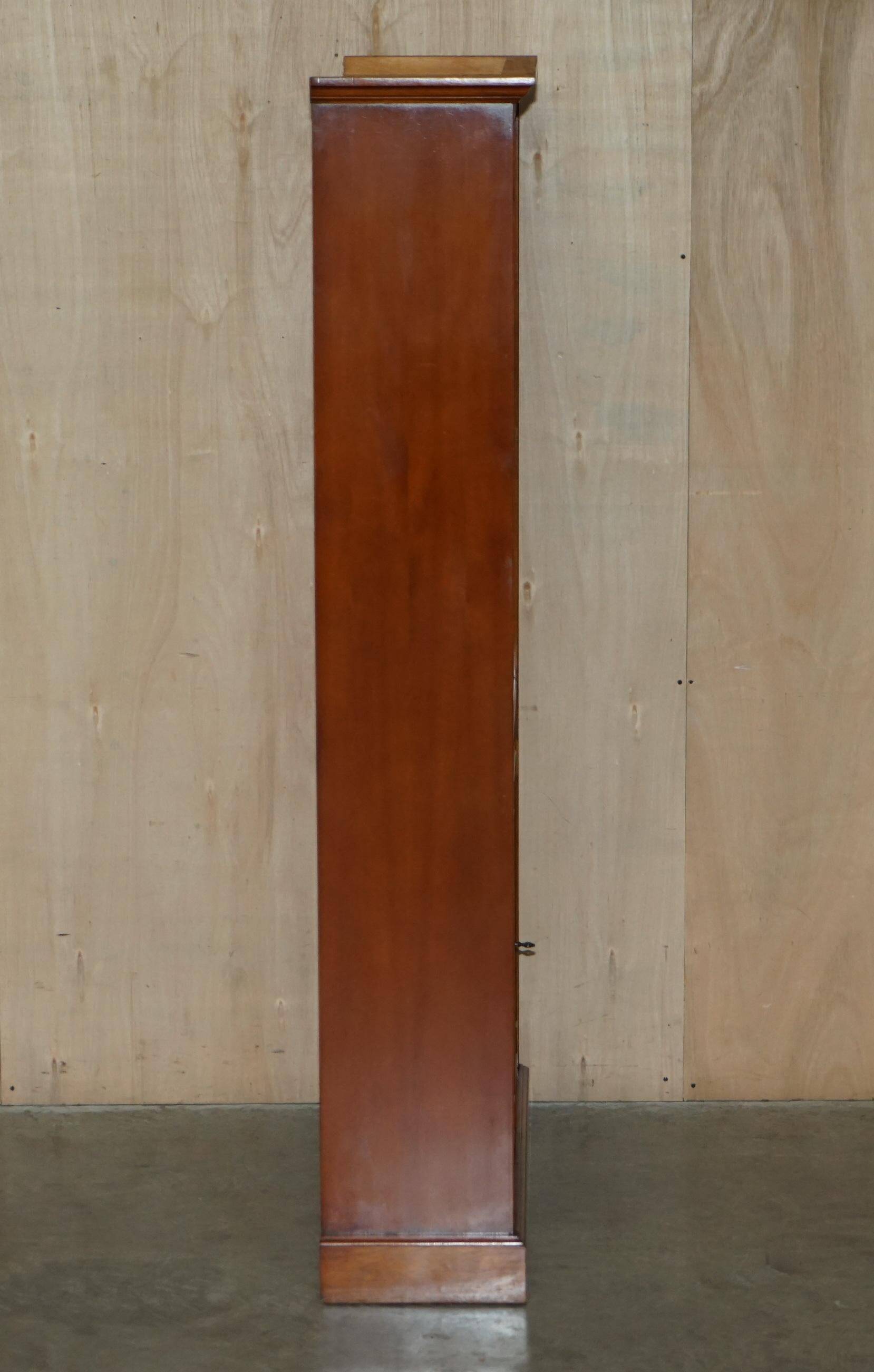 Open library Bradley Furniture made of yew wood with a cupboard base.