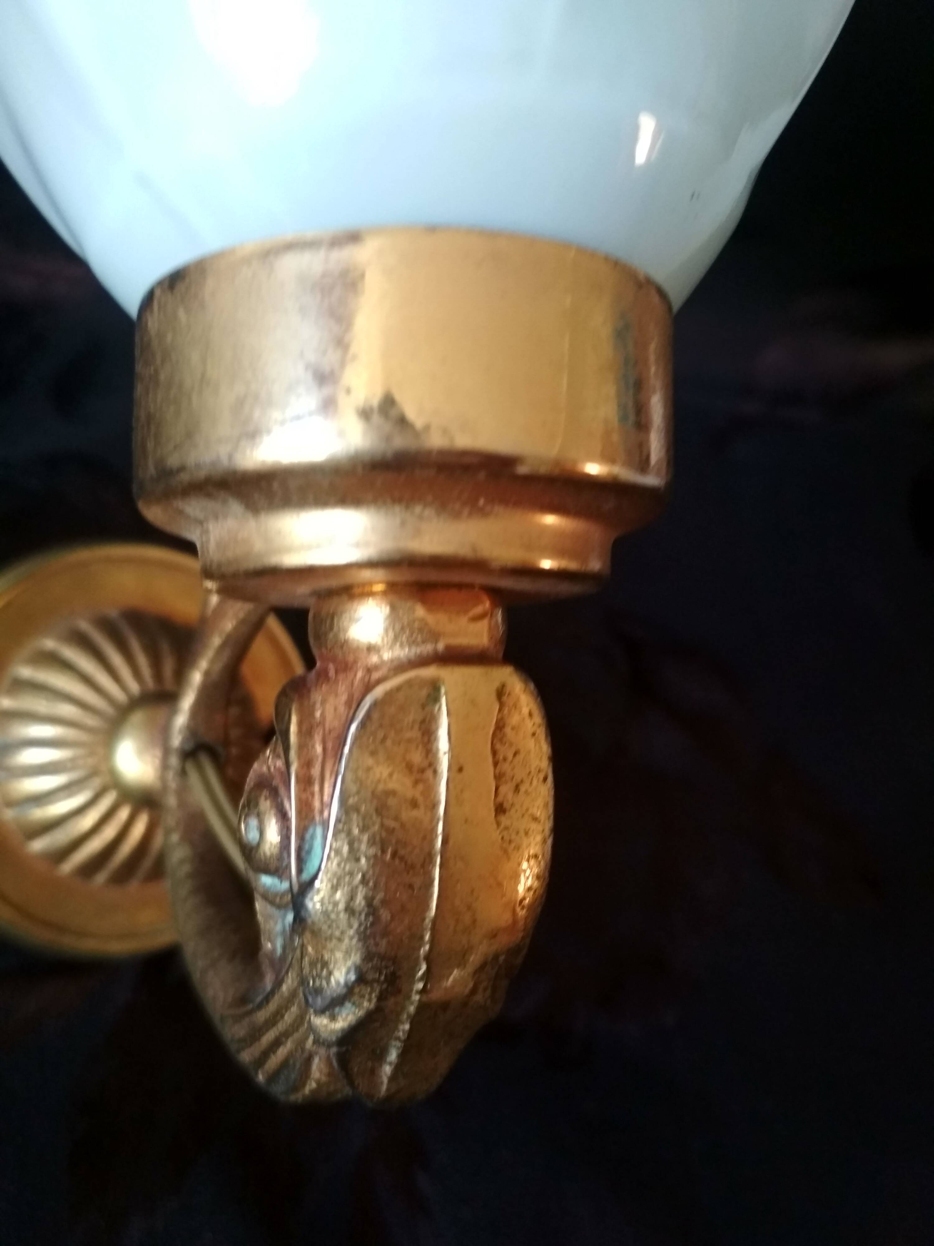 Golden brass wall light with glass tulip - dolphin pattern bathroom lamp