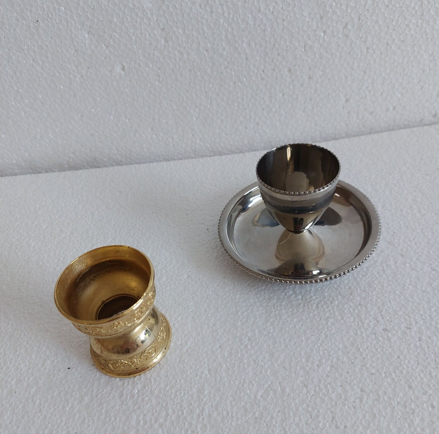 Duo of cockroaches, metal.