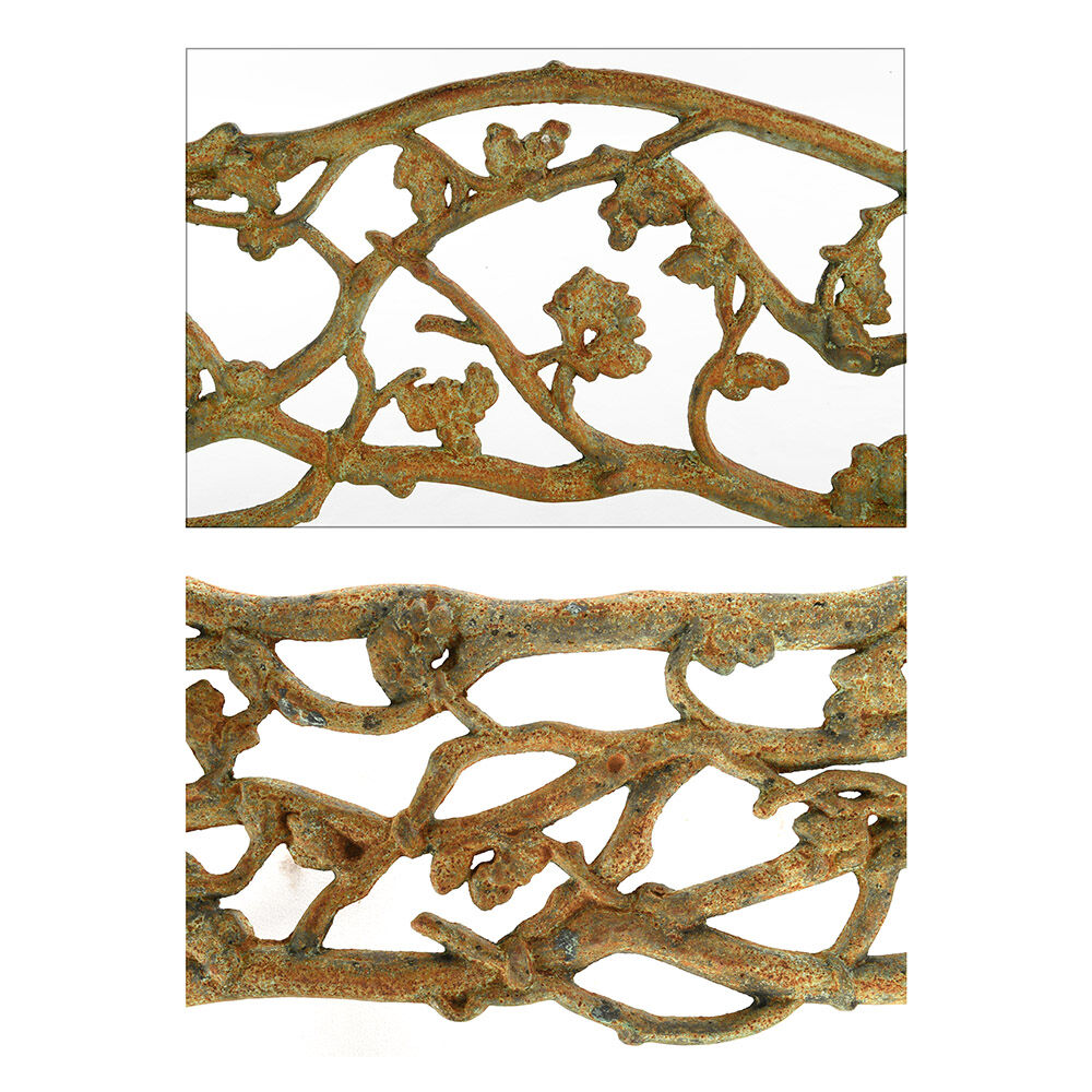 Green cast iron bench with green patina