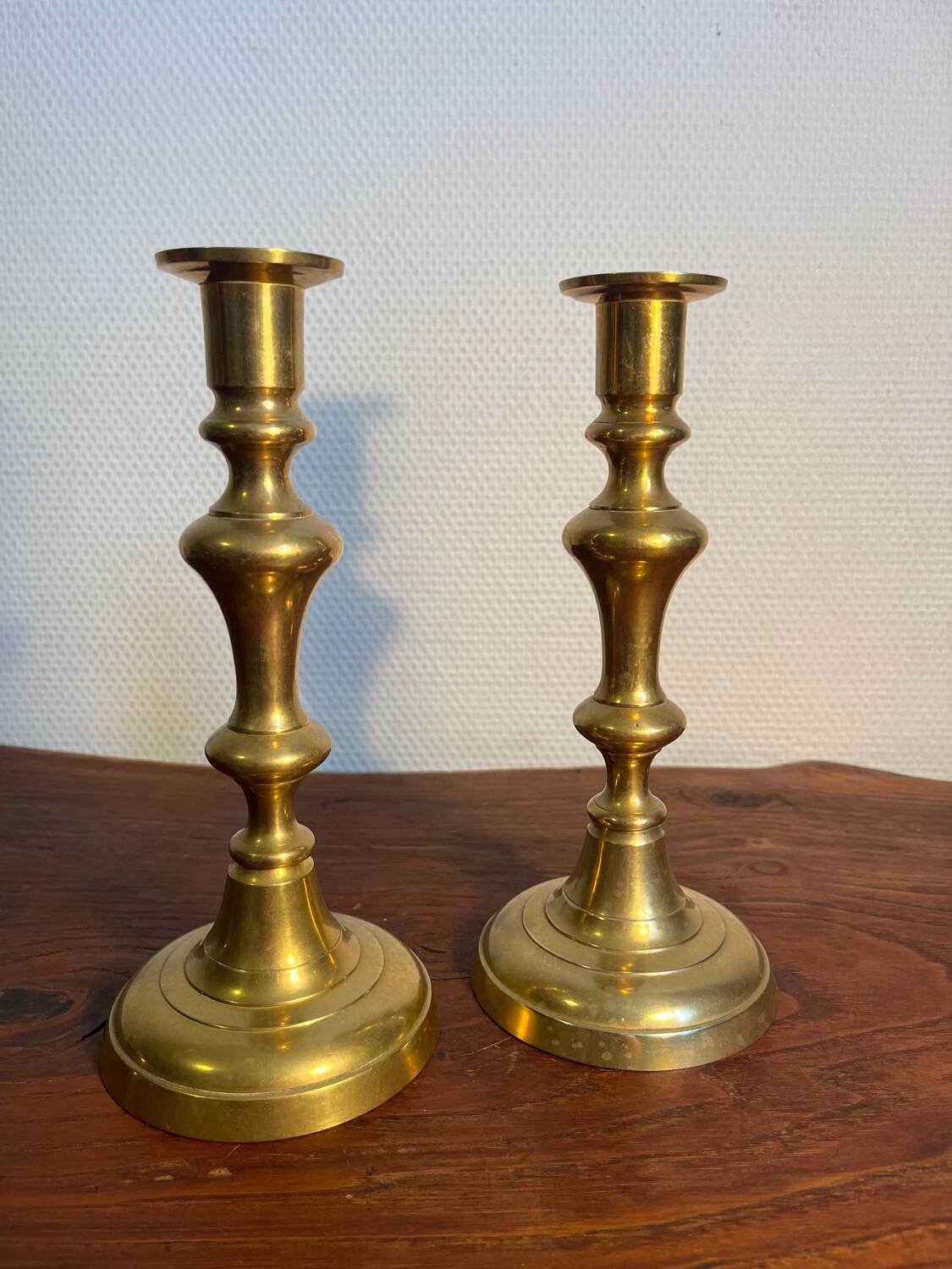 Pair of duo of ringed brass candlesticks