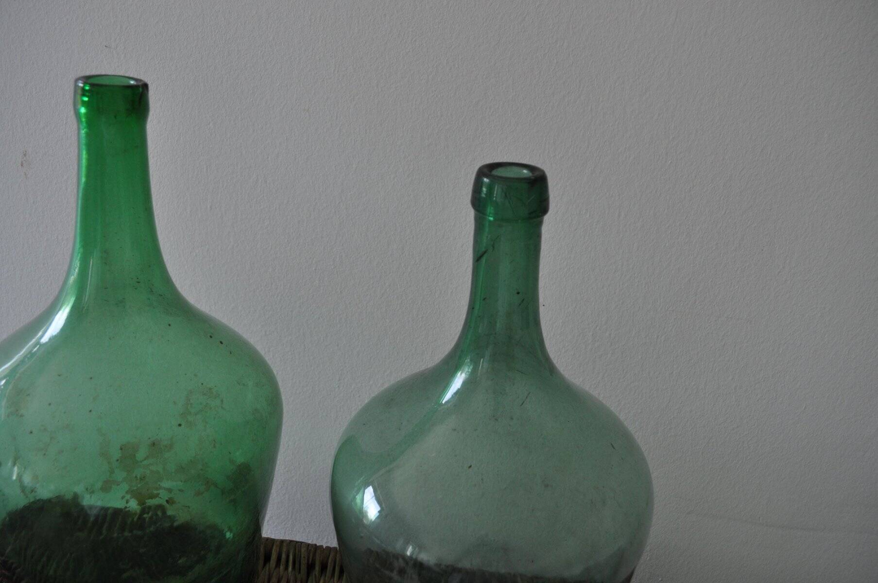 Pair of vintage green glass bottles — Hungarian carboys from the 1960s.