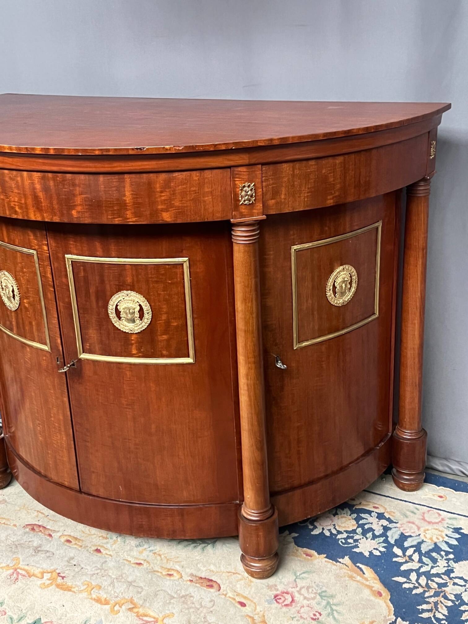 Empire style sideboard. Mahogany. Gilded bronze decoration.