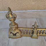 Louis XVI style bronze andirons and fireplace bar