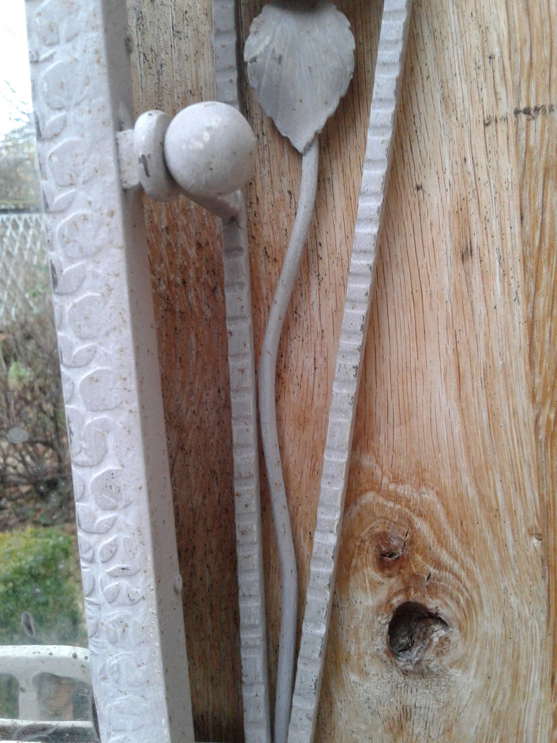 Former Wall coat hangers painted in gray iron