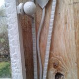 Former Wall coat hangers painted in gray iron