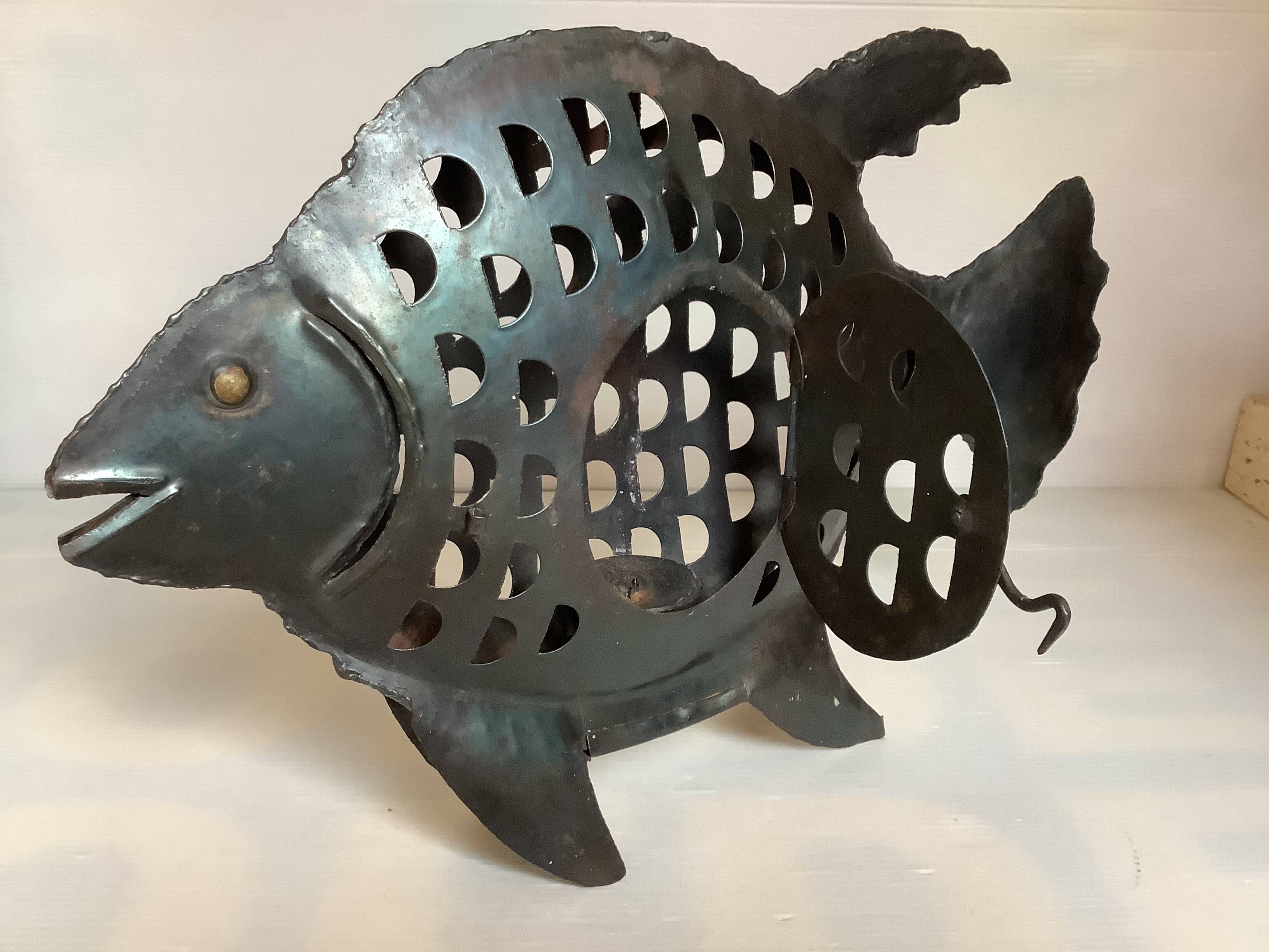 Large metal fish-shaped candle holder