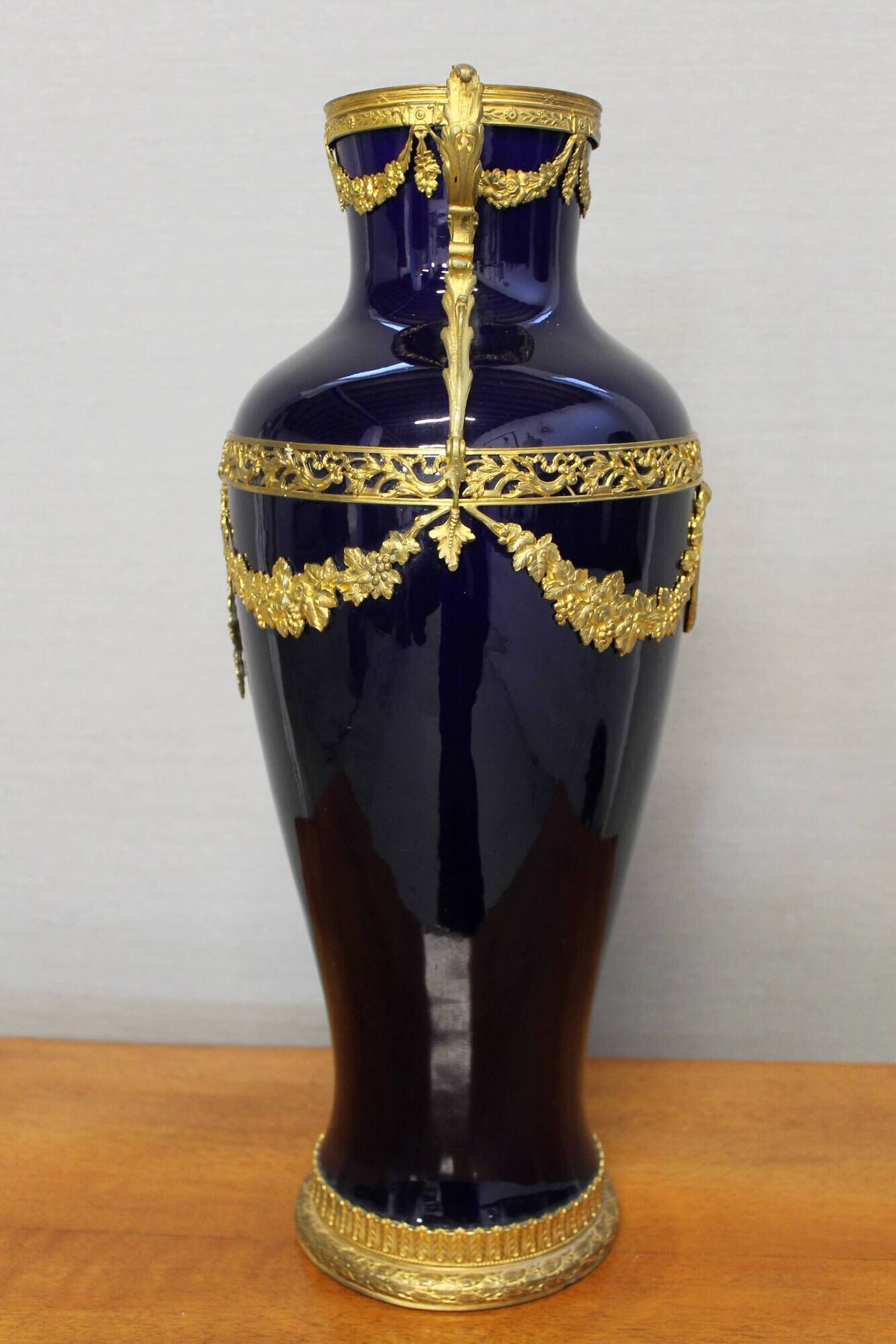 Vase signed Legastelois in blue ceramic of Sèvres and gilded bronze