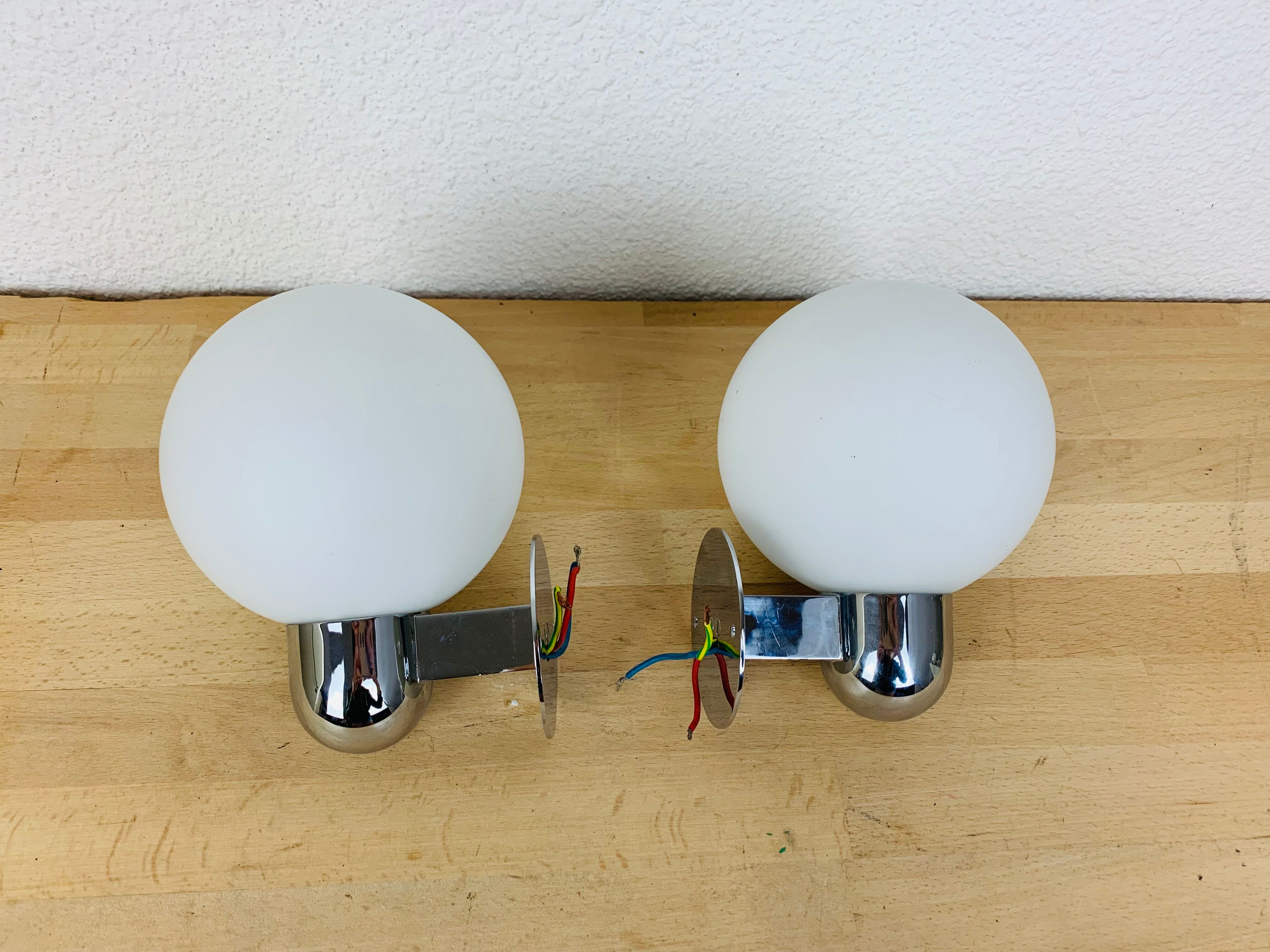 Pair of wall lamps space age chrome and opal globe 70s