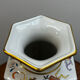 Porcelain vase with flower decorations by Dawen Wang.