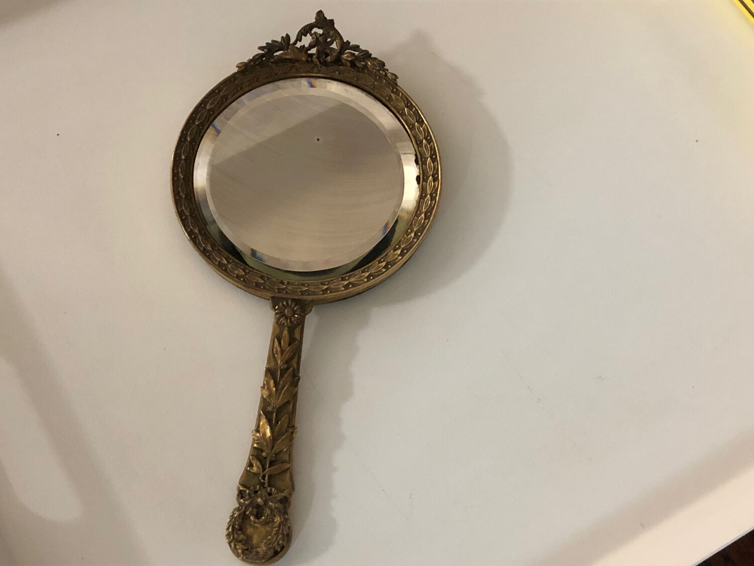 Hand mirror in gilded bronze