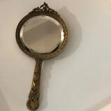 Hand mirror in gilded bronze