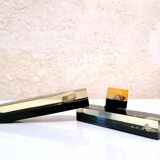 Set of 11 blackened resin knife holders, 1970s