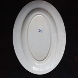 Antique serving dish in white and blue earthenware.