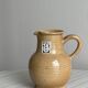 Hand-thrown ceramic pitcher