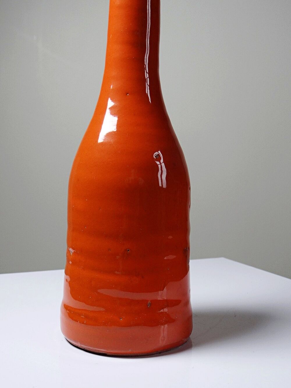 Bright orange mid-century decorative bottle lamp base glazed pottery.