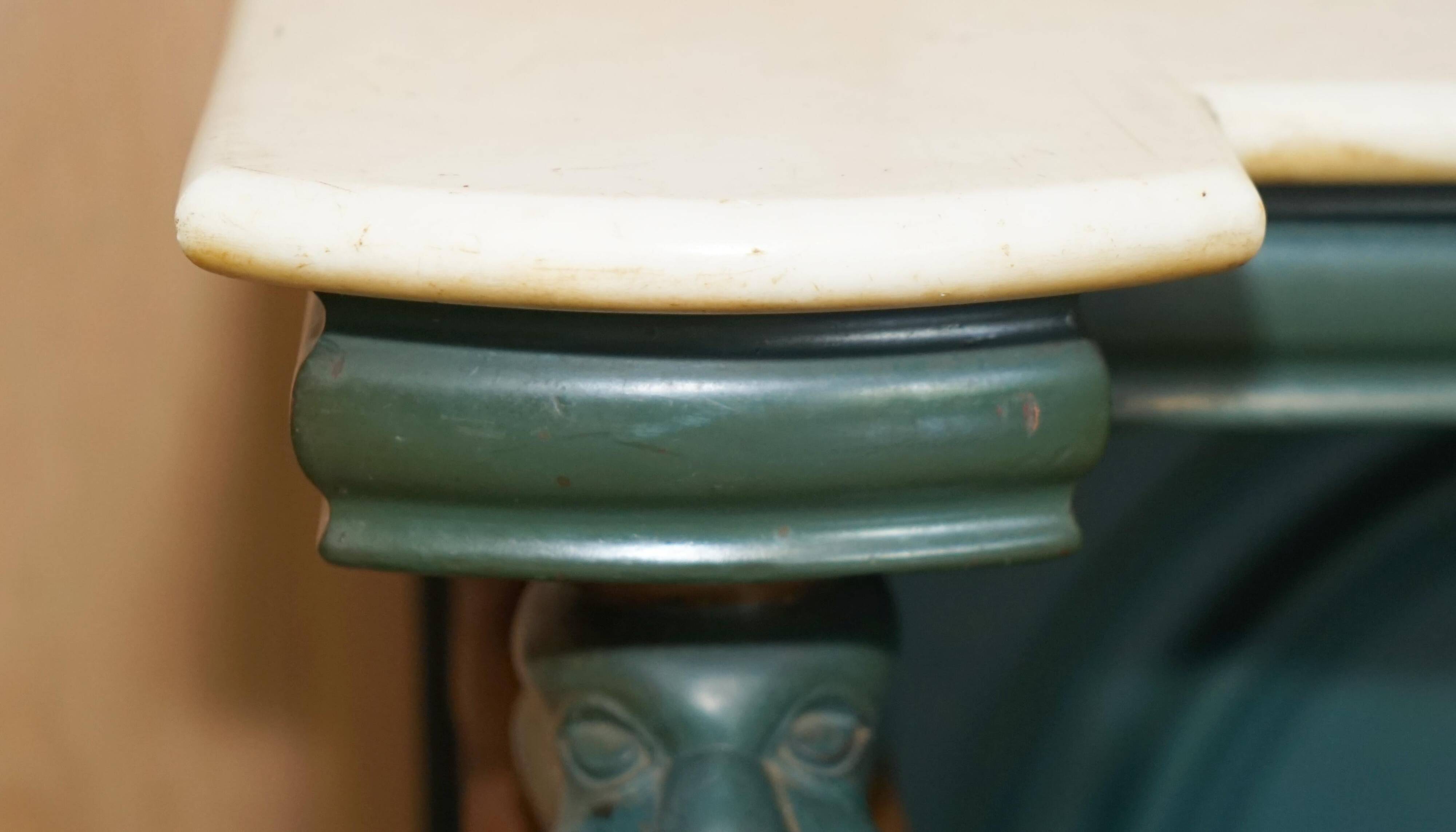 Antique hand-carved console circa 1880 with a marble top.