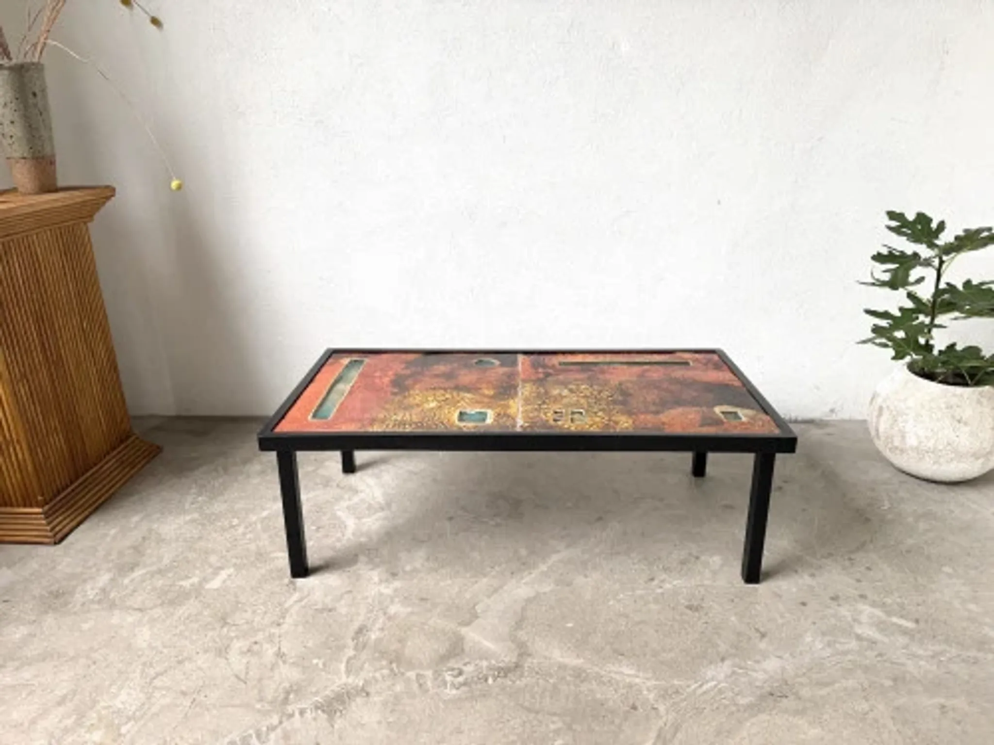 Coffee table by Robert and Jean Cloutier in enamelled lava and metal, 1950s.