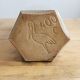 Hexagonal sandstone bottle