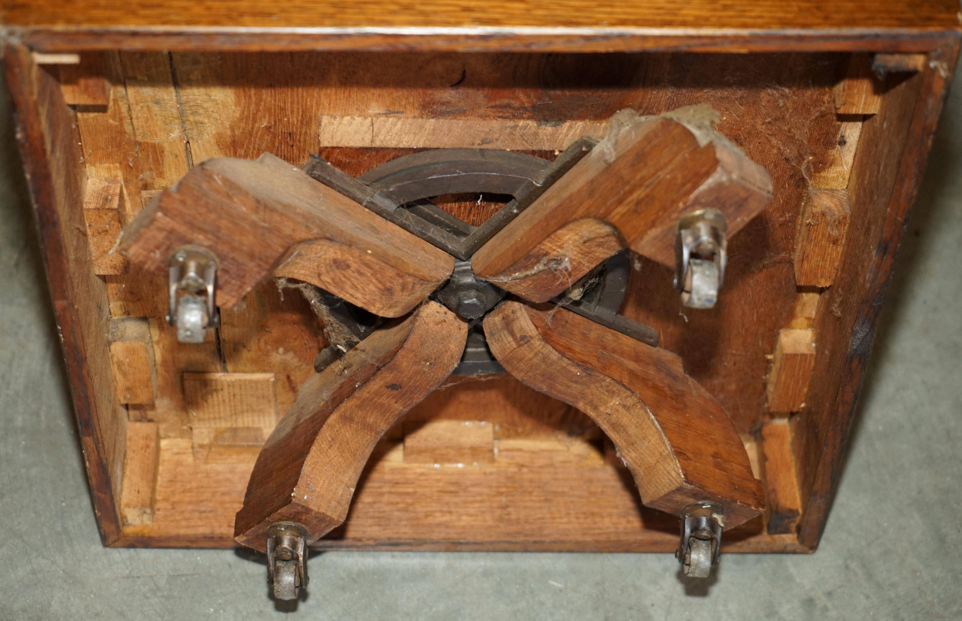Victorian carved oak revolving library, circa 1880.