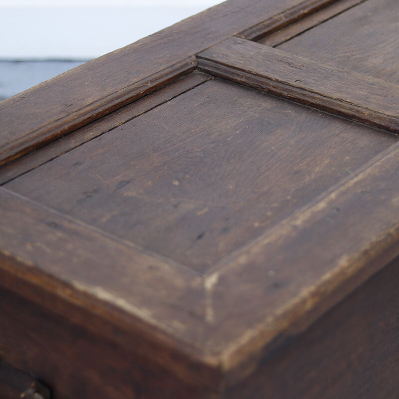 Rustic and weathered antique oak chest from the 18th century.
