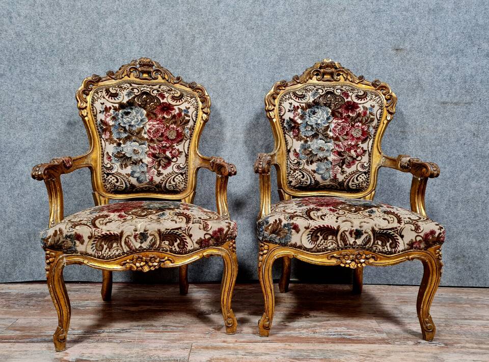 Pair of Louis XV style Baroque armchairs in gilded and carved wood circa 1900