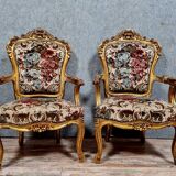 Pair of Louis XV style Baroque armchairs in gilded and carved wood circa 1900