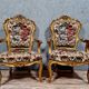 Pair of Louis XV style Baroque armchairs in gilded and carved wood circa 1900
