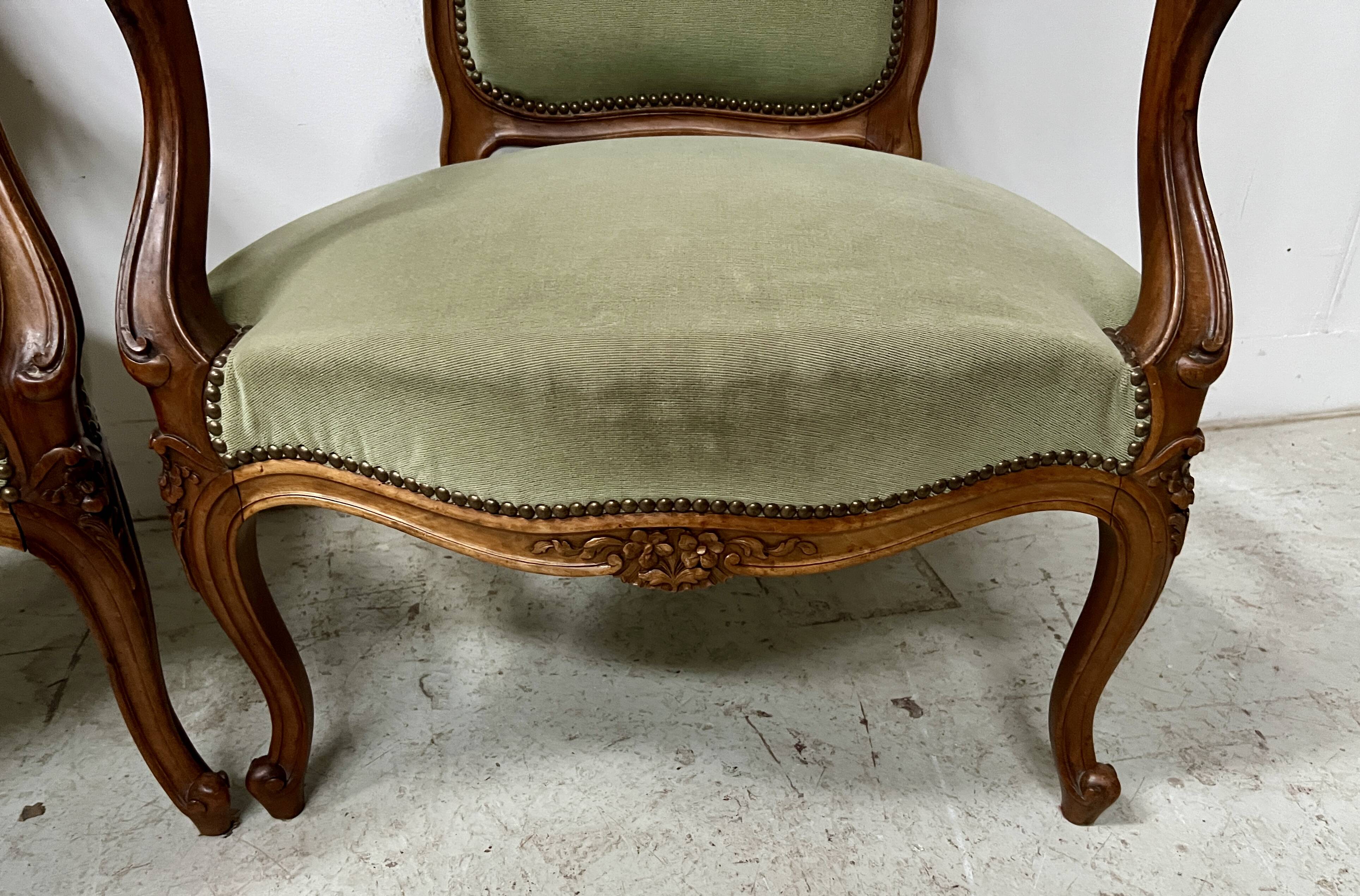 Pair of Louis XV style armchairs in solid walnut, 20th century.