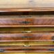 Antique walnut commode with bronze handles in the shape of a lion's mask,