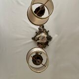 Chandelier représentant un amour les yeux bandés