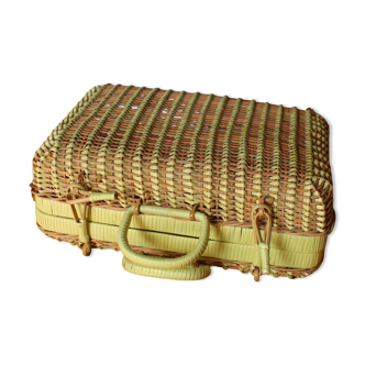 Yellow vintage wicker suitcase