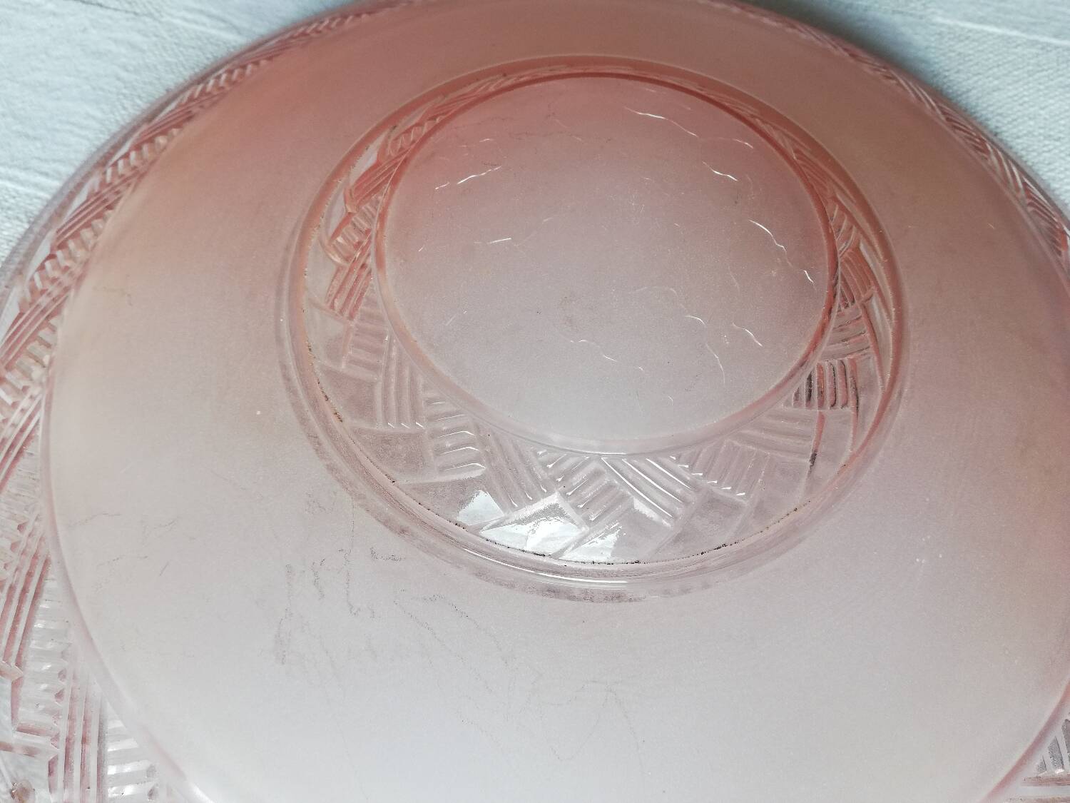 Antique ceiling light in frosted and engraved pink glass.