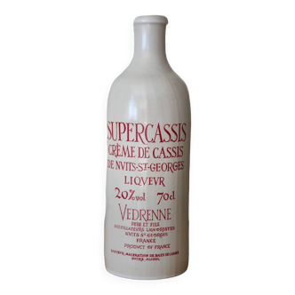 Old stoneware bottle creme de cassis