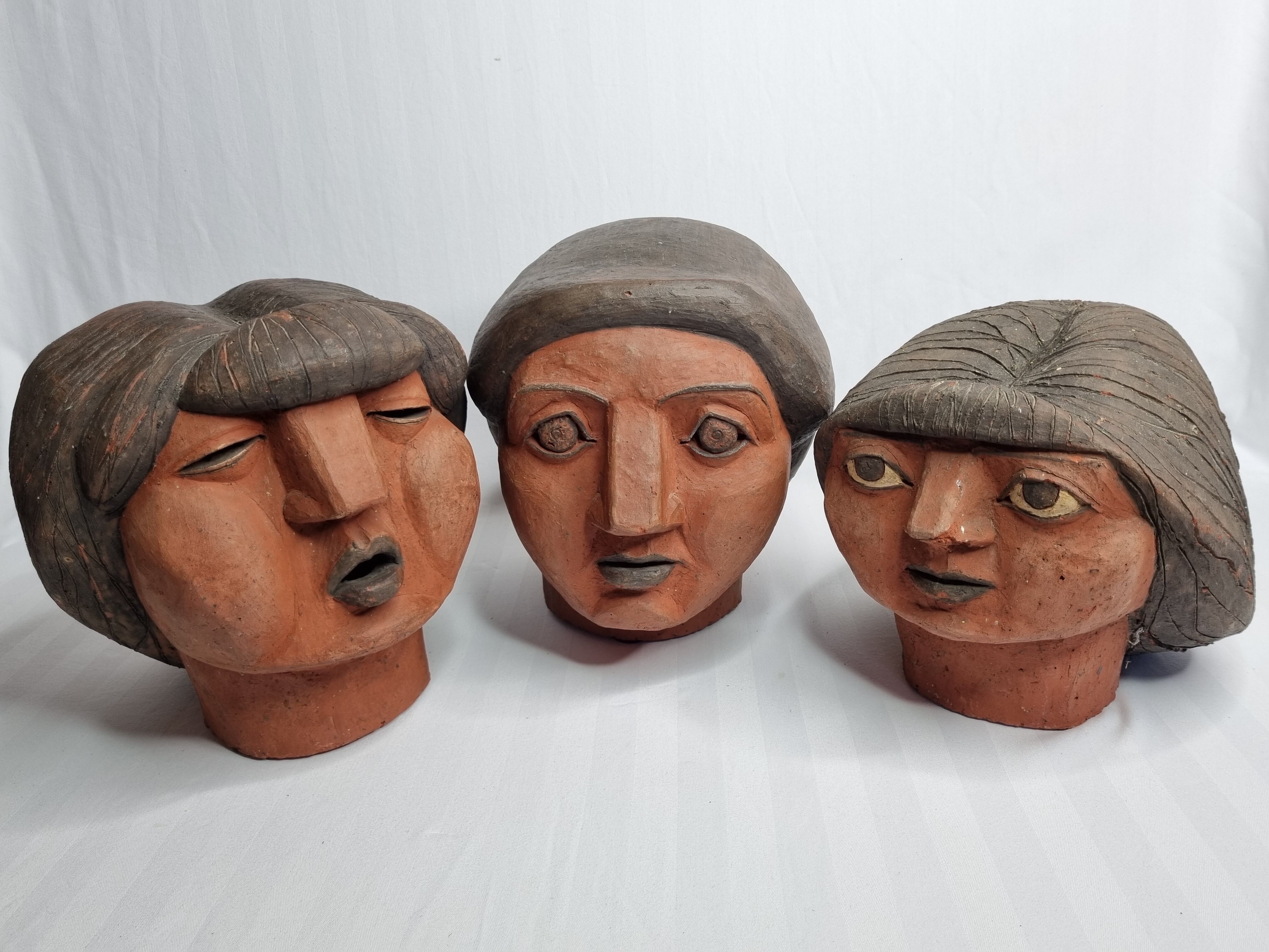 Set of 3 decorative women's heads in red terracotta