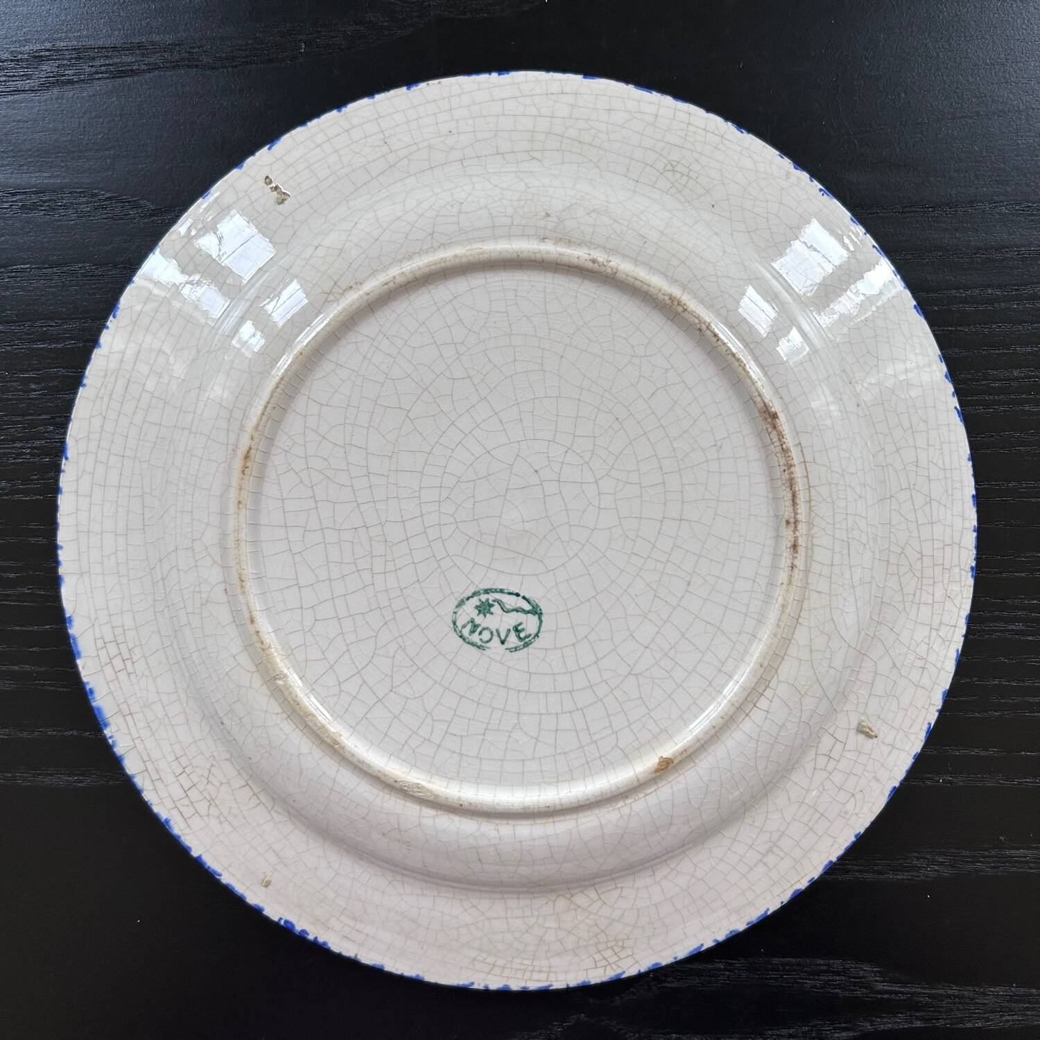 Old plate with rooster decoration