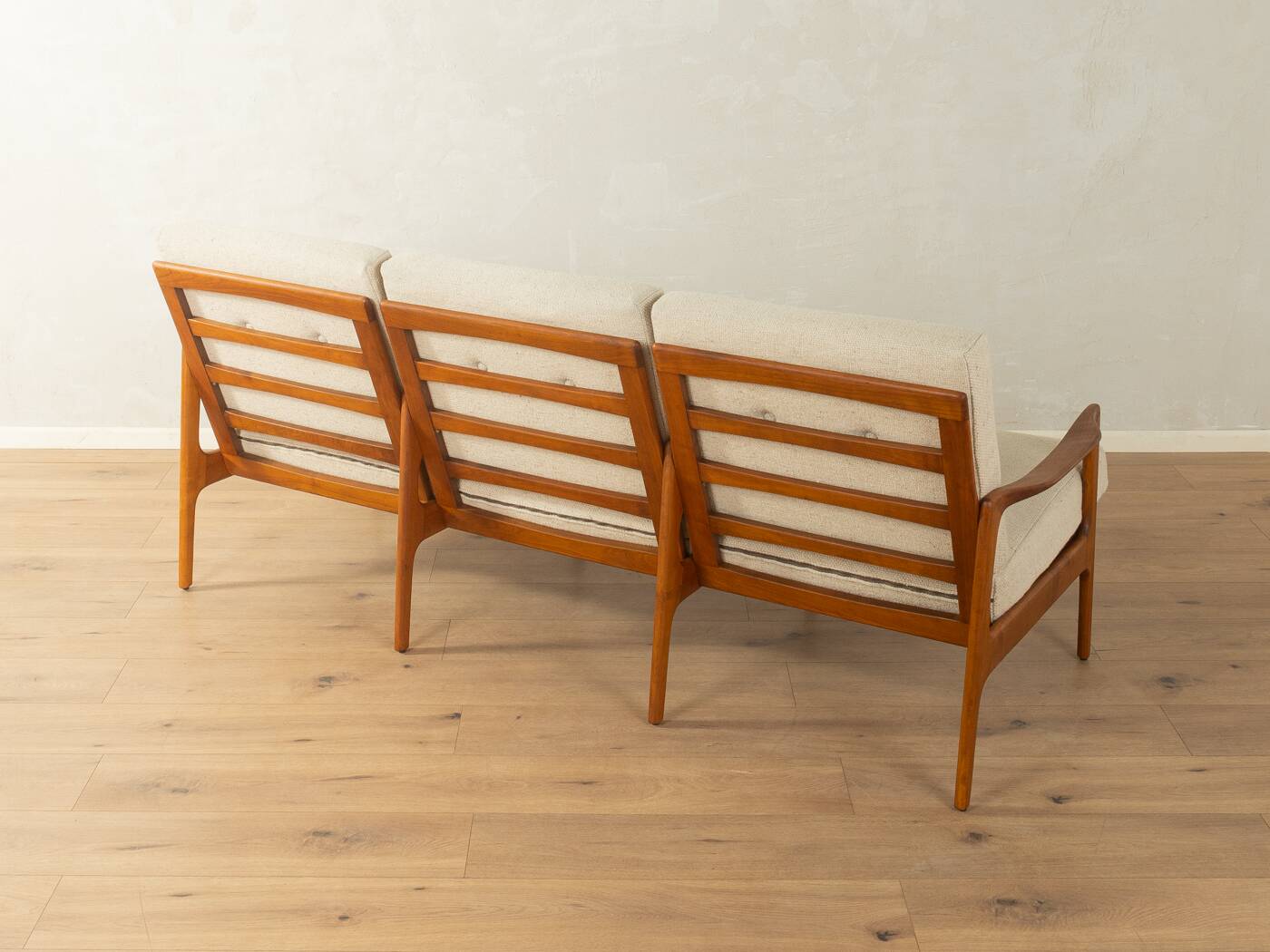 Elegant mid-century sofa from the 1960s with cream-white upholstery