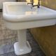 Antique washbasin on ceramic column