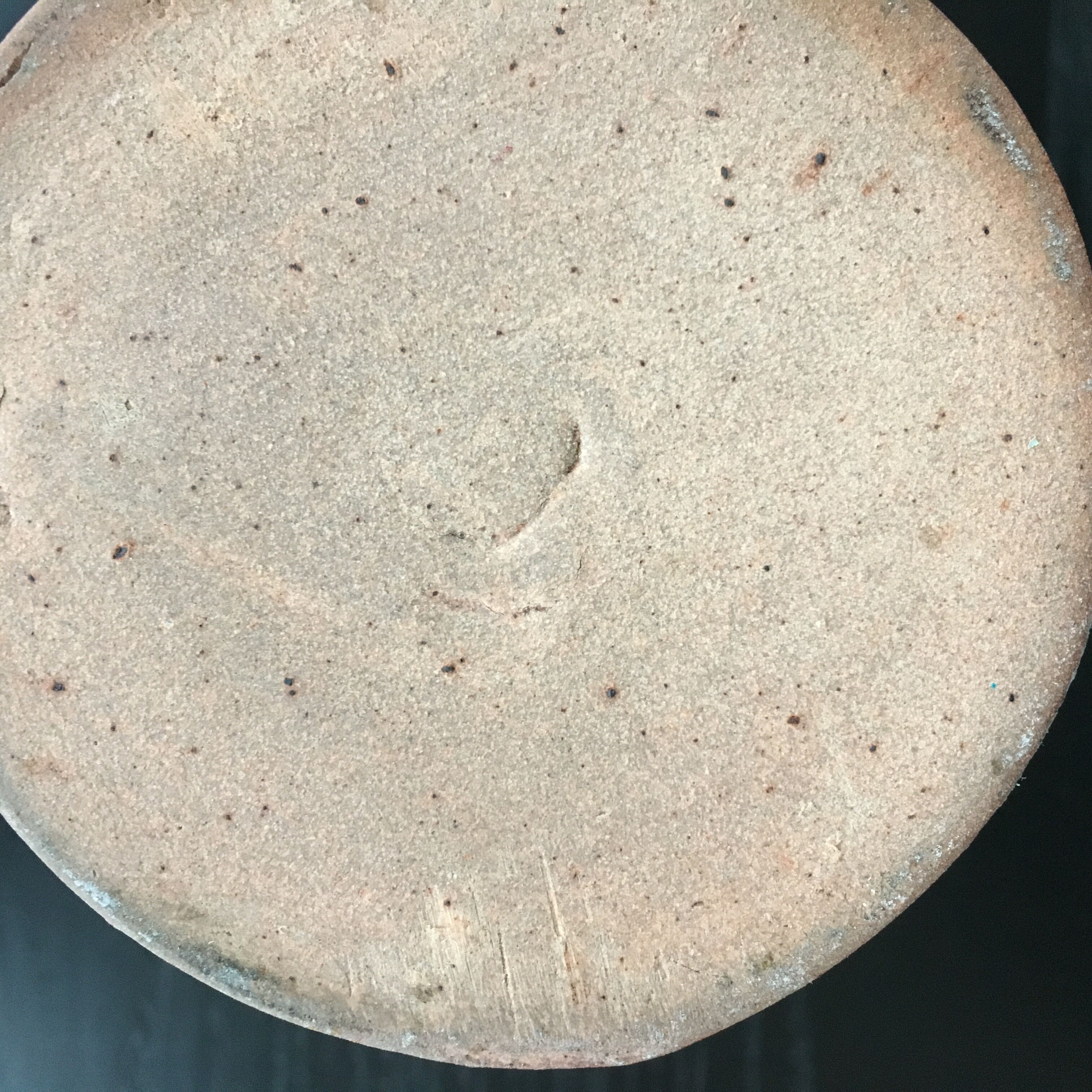 Beige stoneware pitcher with white drips