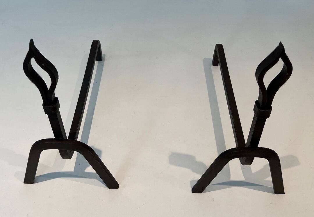 Pair of Modernist Andirons in Wrought Iron with Stylised Torches and Bases Ang