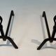 Pair of Modernist Andirons in Wrought Iron with Stylised Torches and Bases Ang
