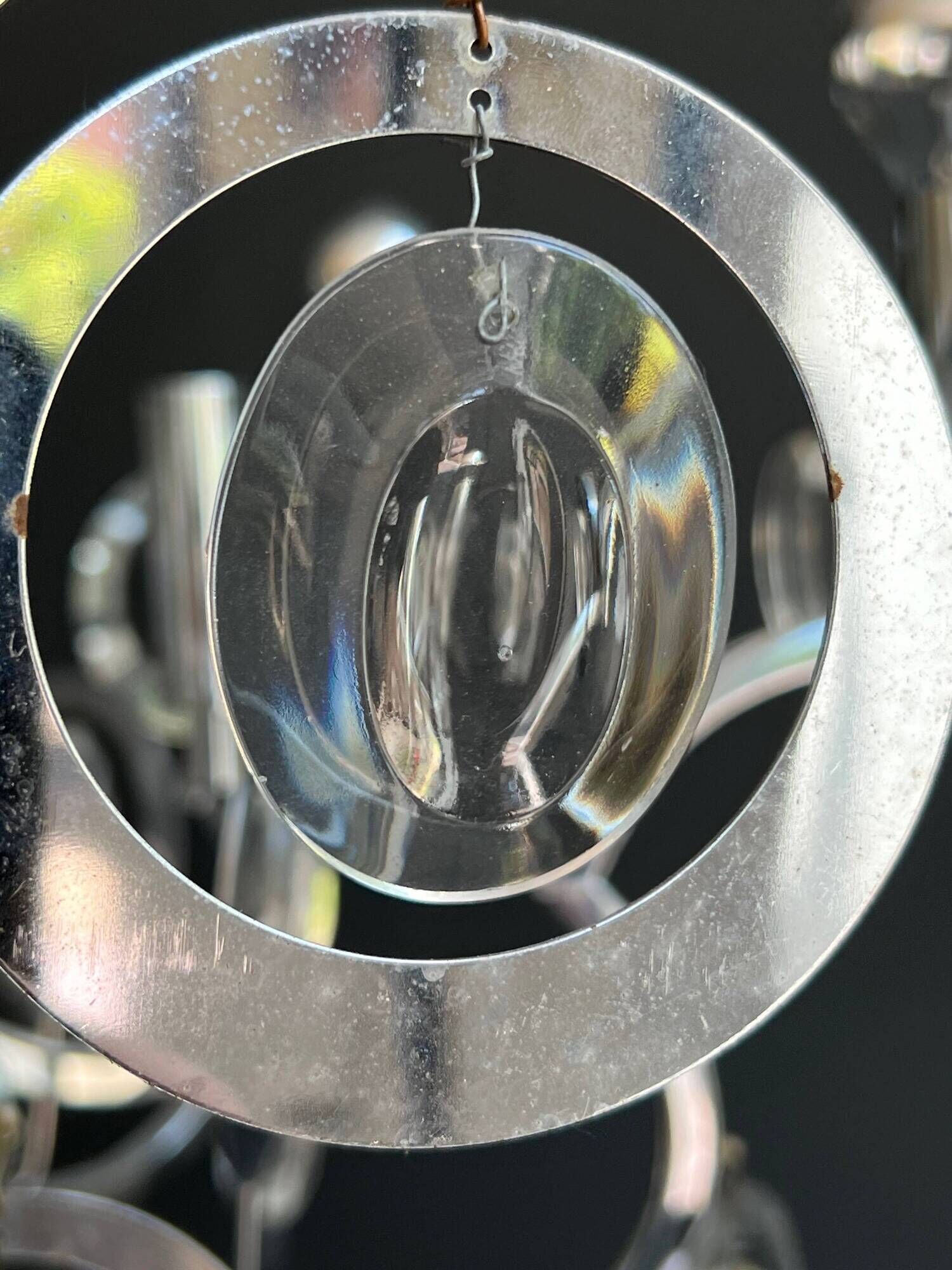 Chrome Metal Design with Swirls and Optical Glass Lenses. Tra