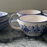 Set of 4 white/blue ceramic cups and saucers.