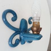 Antique wall light in enamelled cast iron.